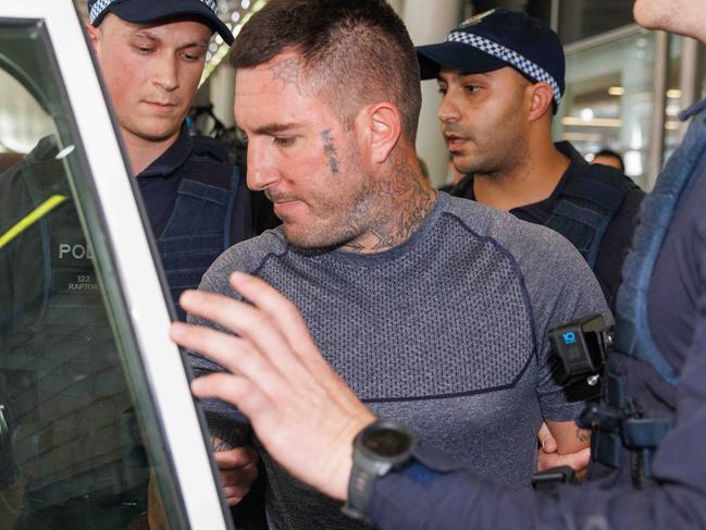 SYDNEY, AUSTRALIA - NewsWire Photos FEBRUARY 10, 2023: Comanchero boss Allan Meehan has been extradited from Queensland and arrived at Sydney Airport under a heavy police presence. Picture: NCA NewsWire / David Swift