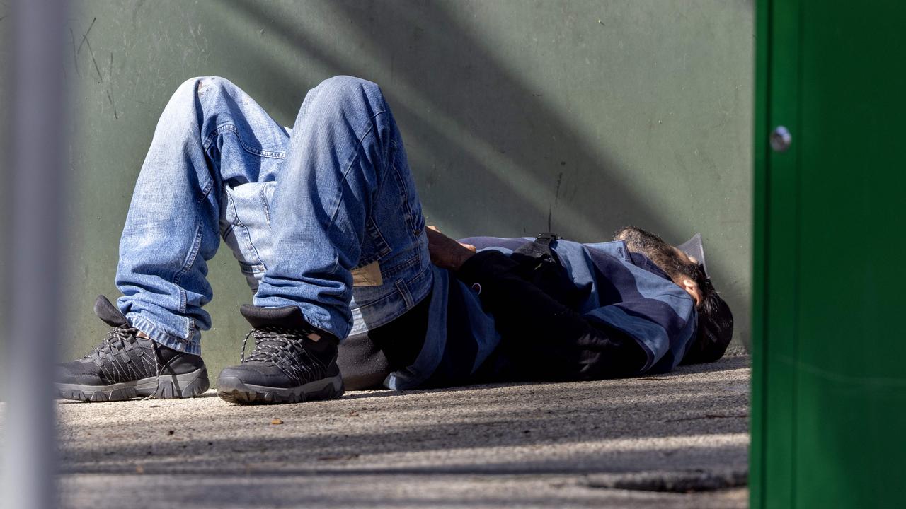 A man passed out after injecting drugs at the nearby Richmond injecting room. Picture: NCA NewsWire / David Geraghty.