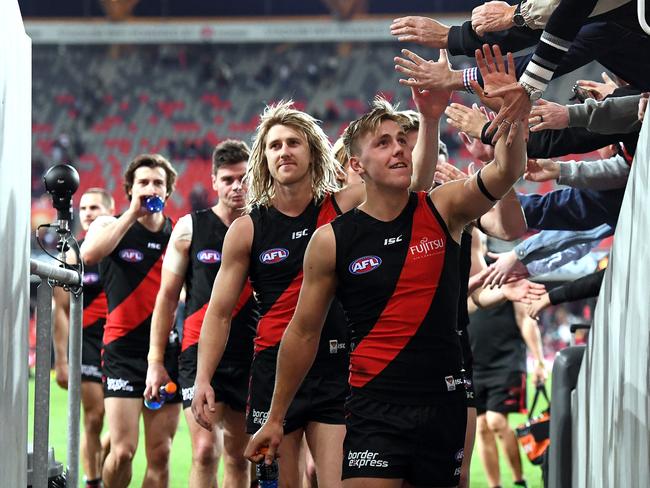 Bombers player Josh Begley (right) was impressive on debut. (AAP Image/Dave Hunt)