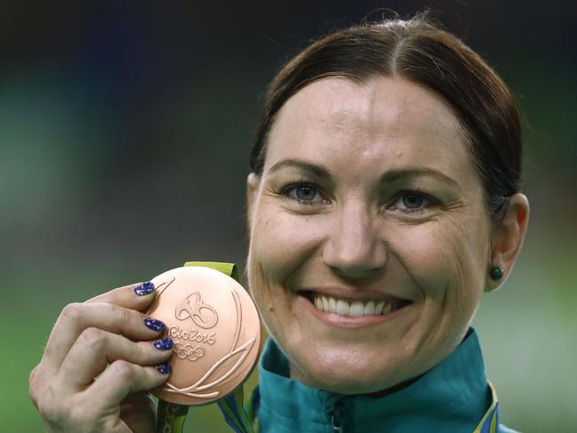 Bronze medallist Australia's Anna Meares poses on the podium after the women's Keirin finals track cycling event at the Velodrome during the Rio 2016 Olympic Games in Rio de Janeiro on August 13, 2016. / AFP PHOTO / Odd Andersen