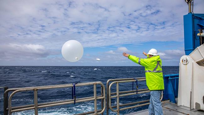 Releasing weather balloon with radiosonde. Picture: Chris Traill They are for single use only, and the publication must fully acknowledge the photographer/s. No archival permission is granted.