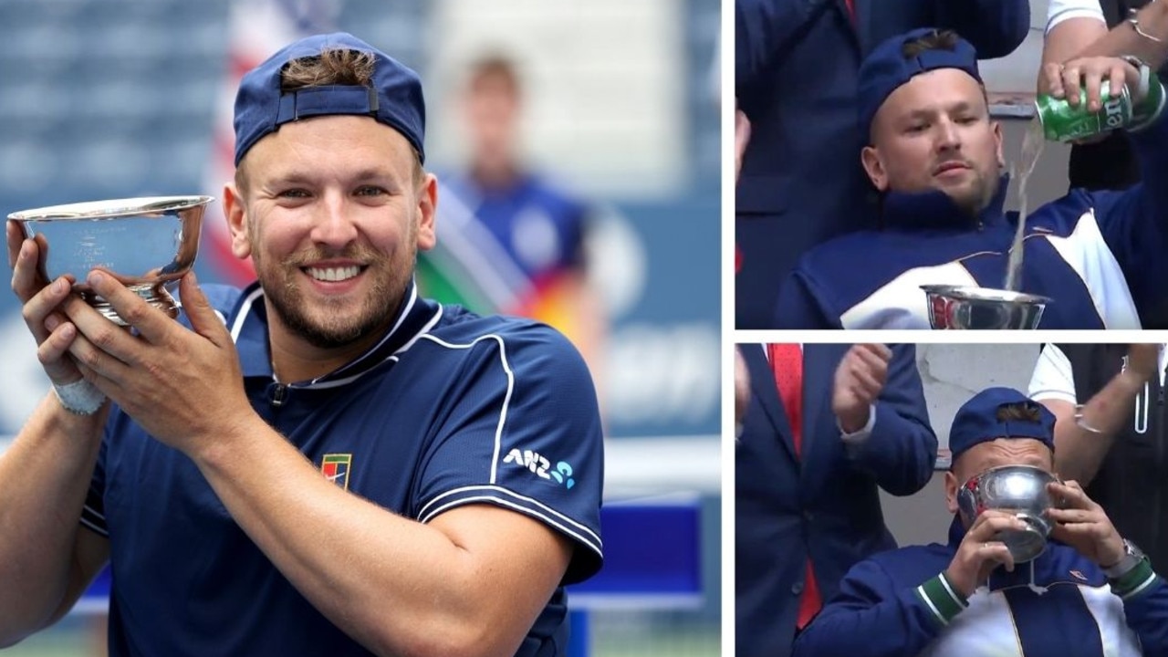 Dylan Alcott raises the cup ... then fills it with beer.