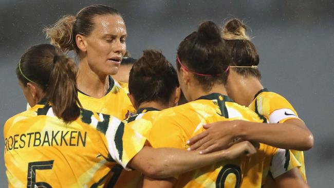 Matildas players celebrate a Caitlin Foord goal. Picture: AFP