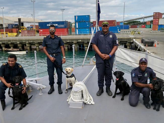 The dog unit that found the drugs. Second from left Mr. Amit Ram of Fiji Revenue and Custom Services with “Eto” the Golden Labrador. Picture: The Fiji Times 