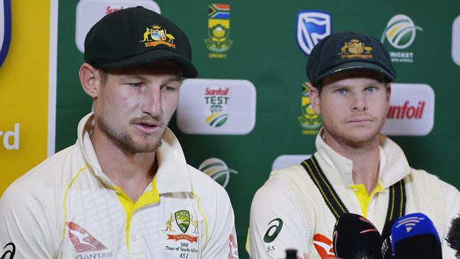 Cameron Bancroft (L) and captain Steven Smith front the press.