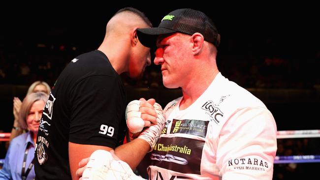 Justis Huni is embraced by Paul Gallen after their fight. Picture: Cameron Spencer/Getty Images