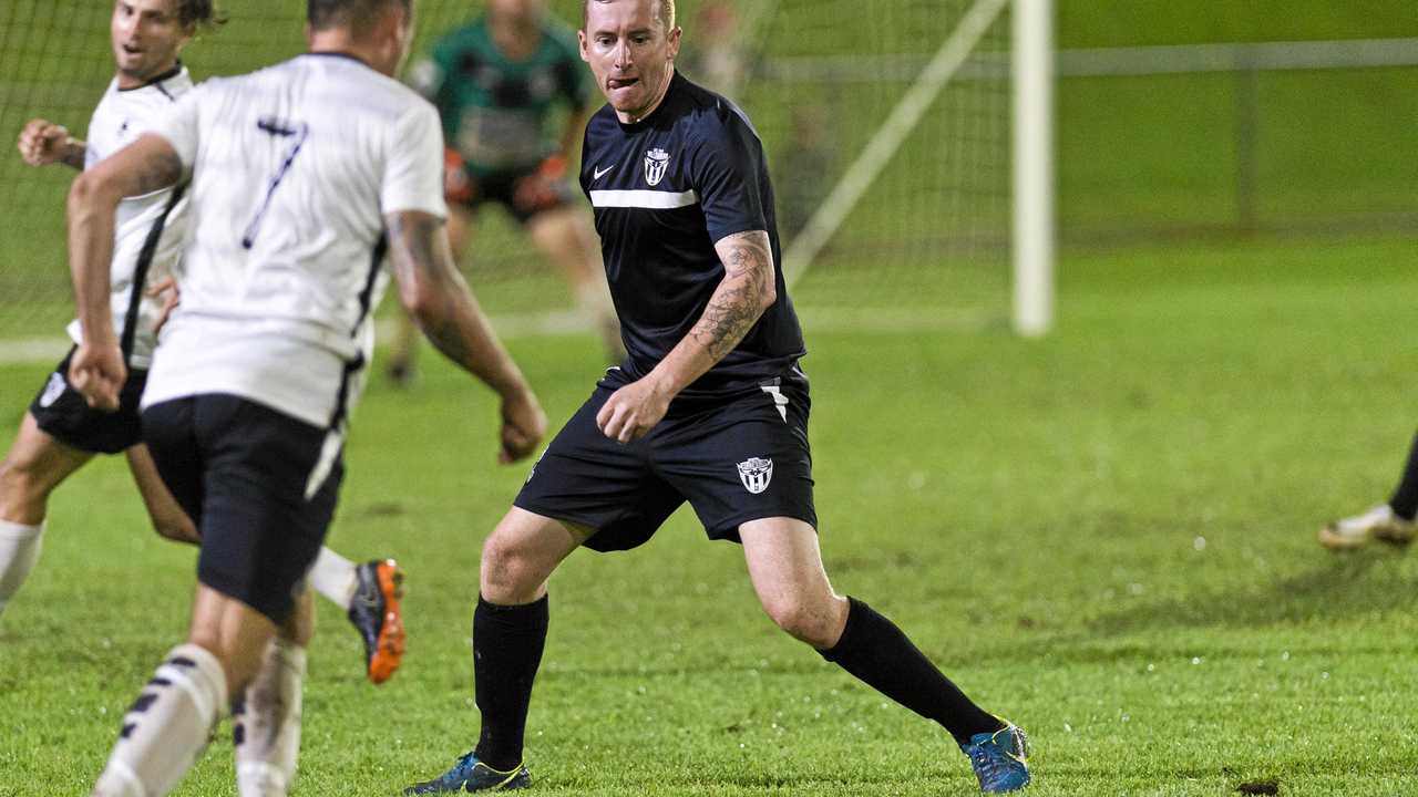 TIGHT DEFENCE: Willowburn White's Matthew Donovan defends during his side's match against club-mates Willowburn FC. Picture: Kevin Farmer