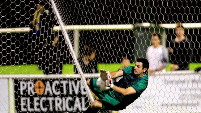 Broadbeach gloveman Michael Negrepontis saves a penalty shot. Picture: Tim Marsden