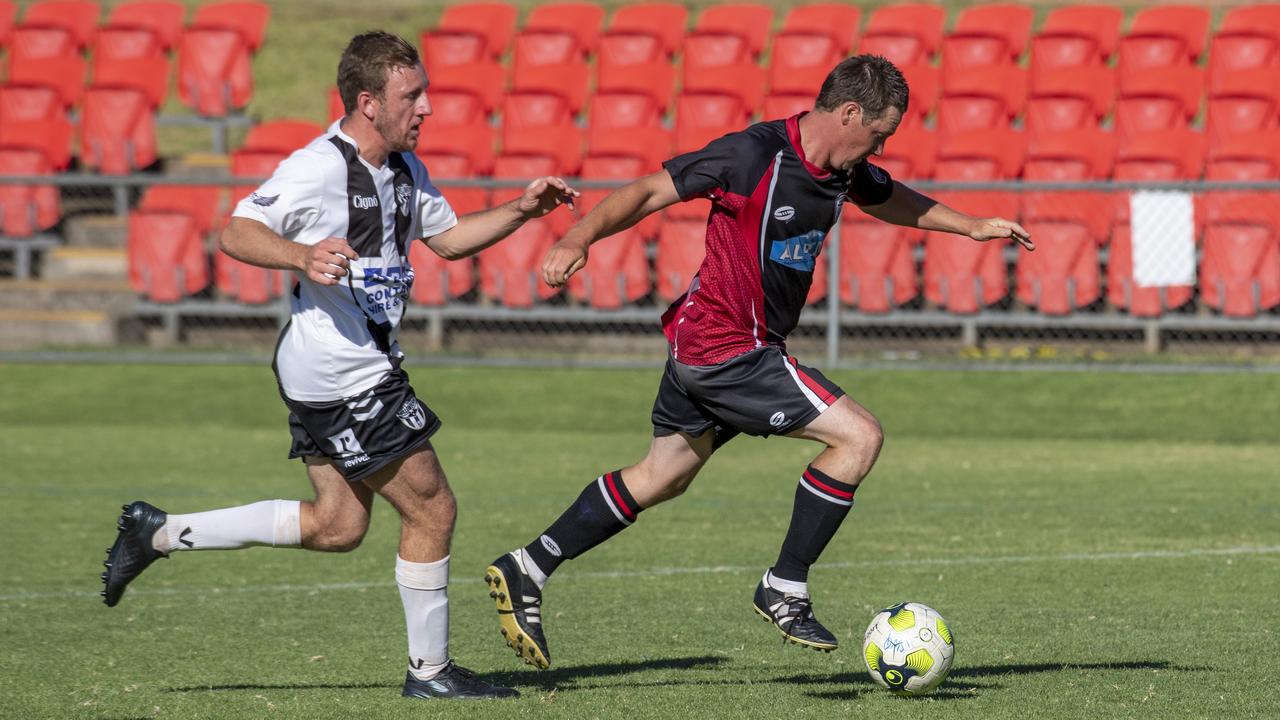 Willowburn’s Daniel Shum (left) closes in on Stanthorpe’s Ace McDonald.