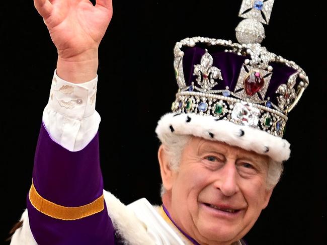 King Charles III waves from the Buckingham Palace balcony after his Coronation service. Picture: Leon Neal/Getty Images