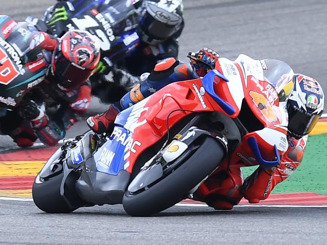 Australian rider Jack Miller of the Pramac Racing rides his bike ahed of France's rider Fabio Quartararo of the Petronas Yamaha SRT and Spain's rider Maverick Vinales of the Monster Energy Yamaha MotoGP in the MotoGP race during the Aragon Motorcycle Grand Prix at the Aragon Motorland racetrack in Alcaniz, Spain, Sunday, Sept. 22, 2019. (AP Photo/Jose Breton)