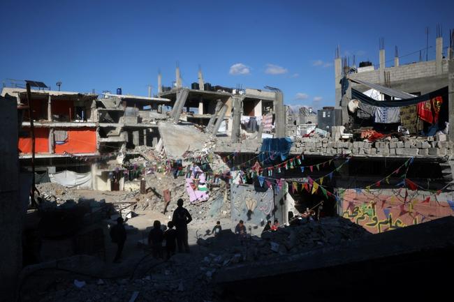 Traditional Ramadan lanterns hang above the rubble of Khan Yunis in southern Gaza