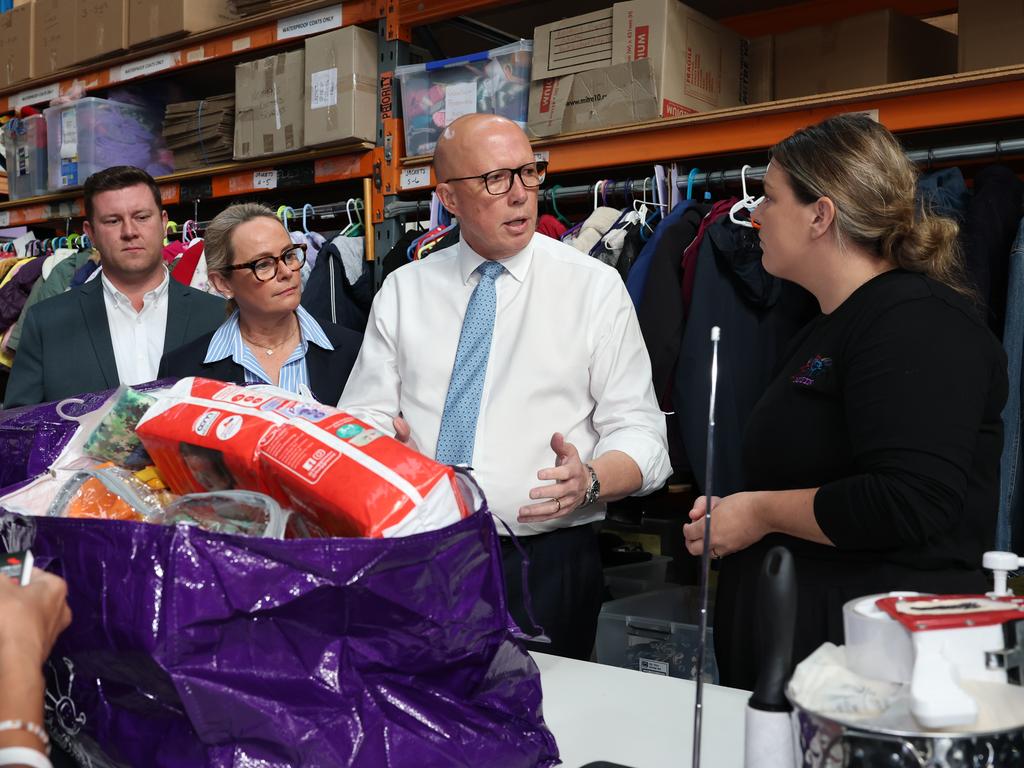 Opposition Leader Peter Dutton with his wife Kirilly and candidate Nathan Conroy visited a centre helping families in need in Frankston on Wednesday. Picture: Adam Head / NewsWire
