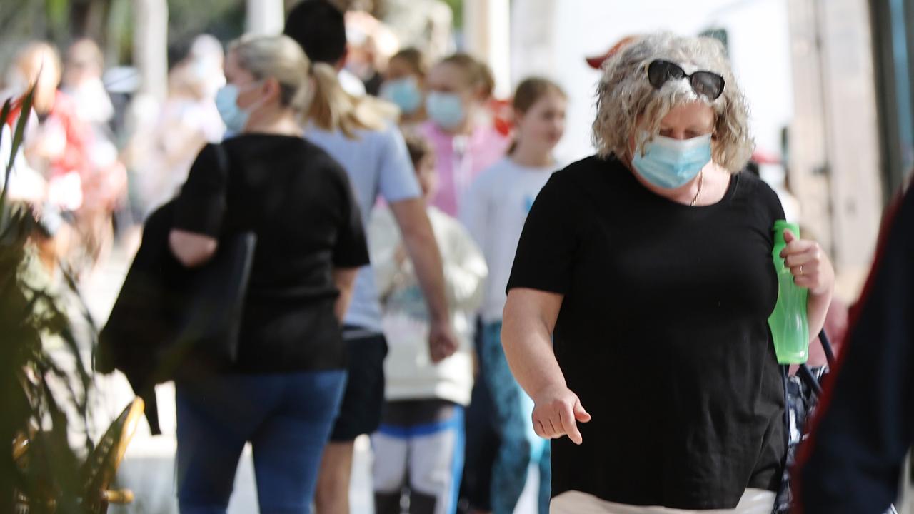 Holiday-makers mask up in Noosa as Queensland prepares to enter a snap-three day lockdown. Picture: Lachie Millard