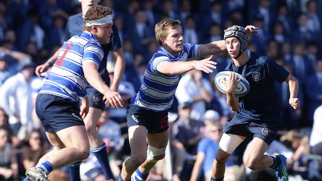 Nudgee's Francois Postal and James Tuttle get set for a tackle playing for Nudgee College Pic Peter Wallis