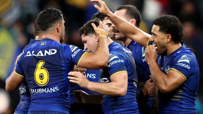 SYDNEY, AUSTRALIA – JUNE 15: Mitchell Moses of the Eels celebrates with teammates after scoring a try during the round 15 NRL match between Parramatta Eels and Sydney Roosters at CommBank Stadium, on June 15, 2024, in Sydney, Australia. (Photo by Brendon Thorne/Getty Images)
