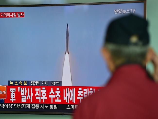 A man watches a TV news showing file footage of a North Korean missile launch at a railway station in Seoul on April 28, 2016. Picture: Jung Yeon-Je/AFP