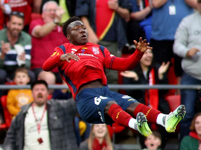 Nestory Irankunda backflips in front of the Adelaide United fans after a goal. Picture: Kelly Barnes/Getty Images