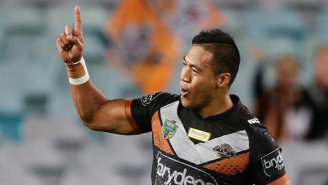 Tigers Tim Simona celebrates after scoring a try during the Wests Tigers v South Sydney rugby league game at ANZ Stadium, Sydney. Pic Brett Costello