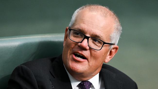 Former prime minister Scott Morrison reacts during House of Representatives question time at Parliament House.