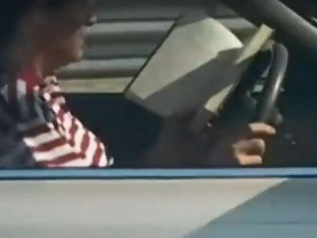 Not novel, but this driver has no qualms about reading a book he obviously can’t put down. Picture: A Current Affair.