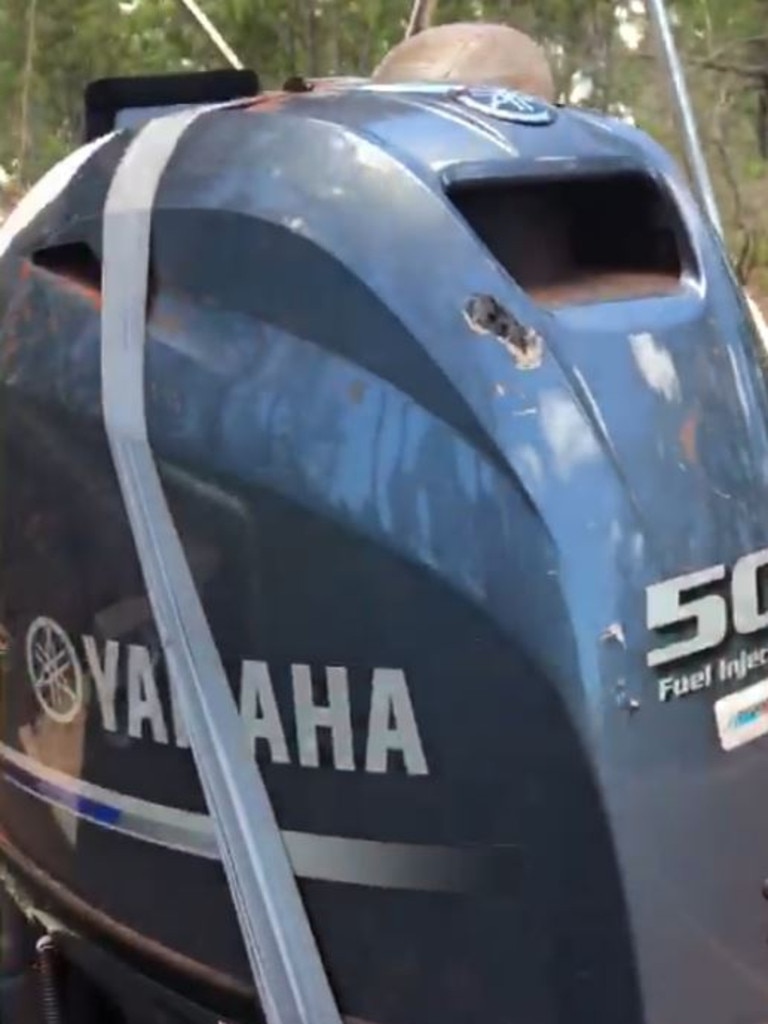 Jason Charles’ boat motor showing the deep teeth marks left in the cover after the terrifying croc attack, and some of the required duct tape running repairs