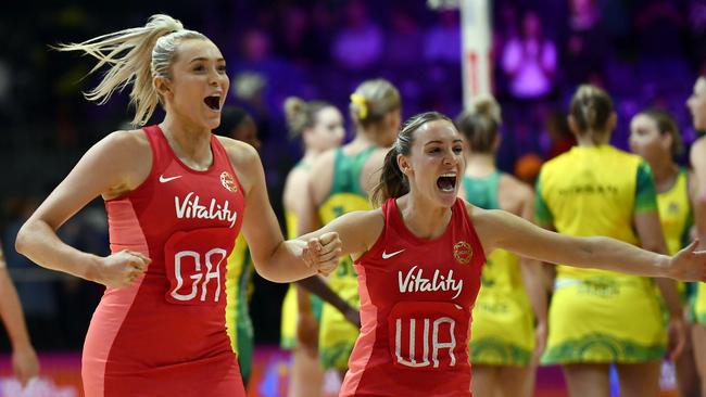 NSW Swifts shooter and player of the World Cup Helen Housby and former Swift Natalie Metcalf celebrate after beating the Diamonds in the round stages of the World Cup in Cape Town before the Diamonds won the final. Photo: Getty Images