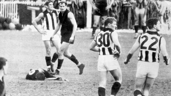 John Somerville on the ground after being knocked out during the preliminary final against Collingwood.