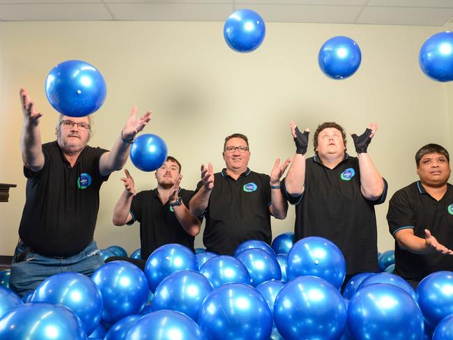 Disability employment services provider MOBO chief executive Andrew Ramsey with supported employees Brian Porteous, Jack Ziegler-Woodruffe, Joanne Hodges and Philip Dwyer, Wednesday, May 16, 2018.  (AAP Image/ Brenton Edwards)