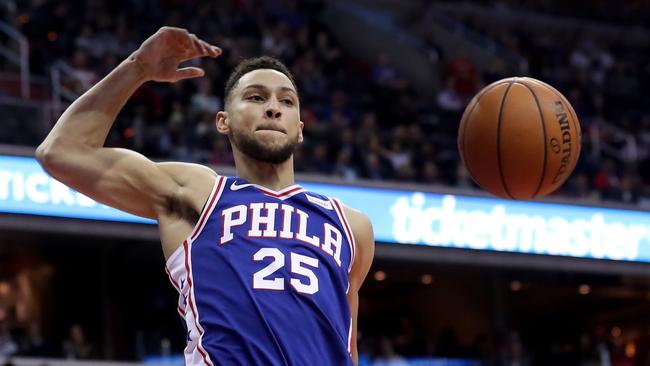 Ben Simmons dunks the ball against the Washington Wizards in his NBA debut on Thursday