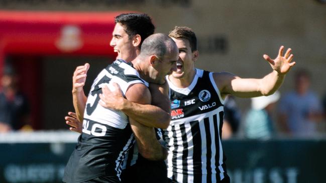 Matthew Broadbent hugs teammate Joel Garner after scoring a goal during the SANFL Port Adelaide versus North Adelaide at Alberton Oval on Sunday, April 14, 2019. (AAP Image/ Morgan Sette)