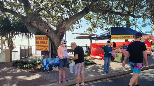 Locals stop passers-by to drum up support to save the pavilion.