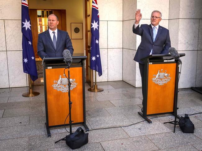 Australian Prime Minister Scott Morrison (right) and Treasurer Josh Frydenberg announce new assistance measures at Parliament House in Canberra yesterday. Picture: AFP