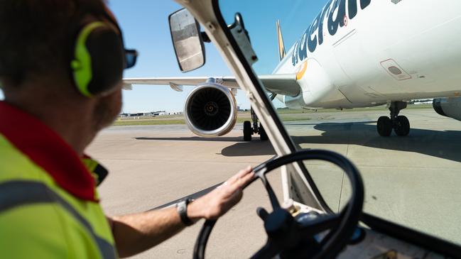 Swissport airport ground staff member Martin Bates working at Brisbane Airport. Picture: Jen Dainer