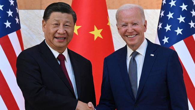 TOPSHOT - US President Joe Biden (R) and China's President Xi Jinping (L) shake hands as they meet on the sidelines of the G20 Summit in Nusa Dua on the Indonesian resort island of Bali on November 14, 2022. (Photo by SAUL LOEB / AFP)