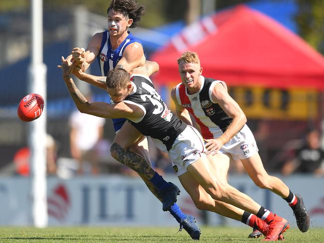 Matthew Parker lays a crunching tackle on Jasper Pittard.