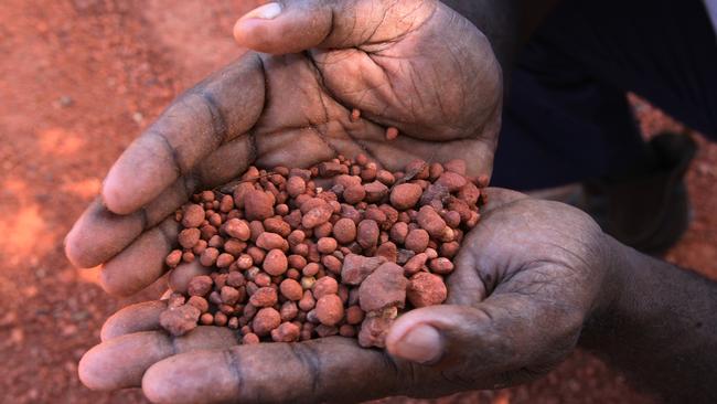 Bauxite in the hands of an Aurukun leader.