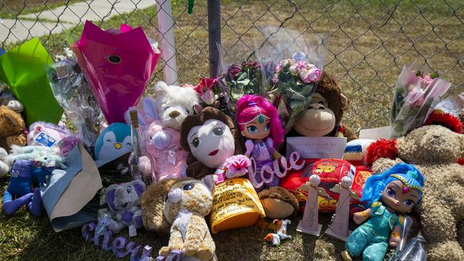 Tributes are seen at a house on Logan Reserve Road, Waterford West, where a mother left her two young daughters in a hot car for more than nine hours in sweltering heat in 2019. Picture: AAP Image/Glenn Hunt