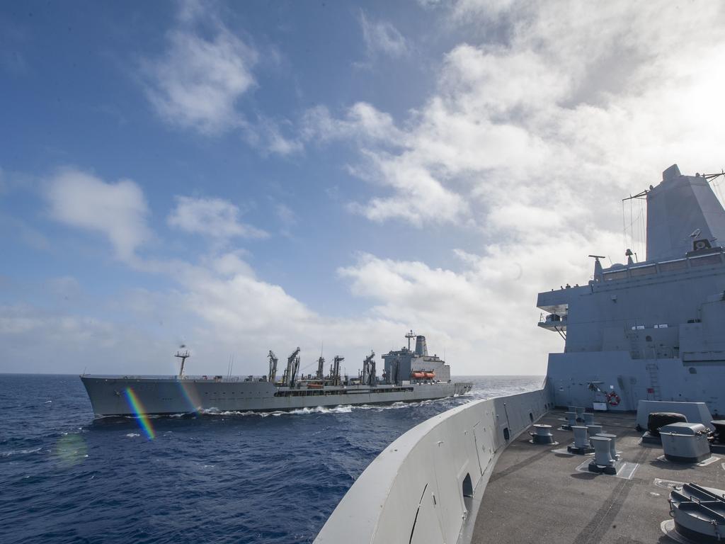 210715-N-XB010-1007 CORAL SEA (July 15, 2021) USS New Orleans (LPD 18) breaking away from a replenishment at sea with USNS Rappahannock (T-AO-204) . New Orleans, part of the America Expeditionary Strike Group, along with the 31st MEU, is operating in the U.S. 7th Fleet area of responsibility to enhance interoperability with allies and partners and serve as a ready response force to defend peace and stability in the Indo-Pacific region. (U.S. Navy photo by Mass Communication Specialist 2nd Class Desmond Parks)