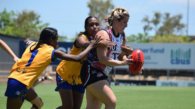 Southern Districts WPL captain Megan Craufurd tackled by Wanderers players during their Round 7 clash at TIO Stadium (2023-24 season). Picture: Alison McGowan / AFLNT Media