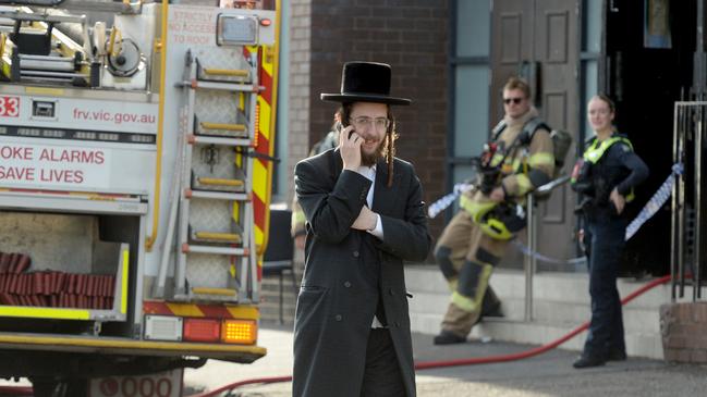 Police and fire crews mop up after the fire at the Adass Israel Synagogue, an ultra orthodox synagogue in Melbourne. Picture: NewsWire/Andrew Henshaw