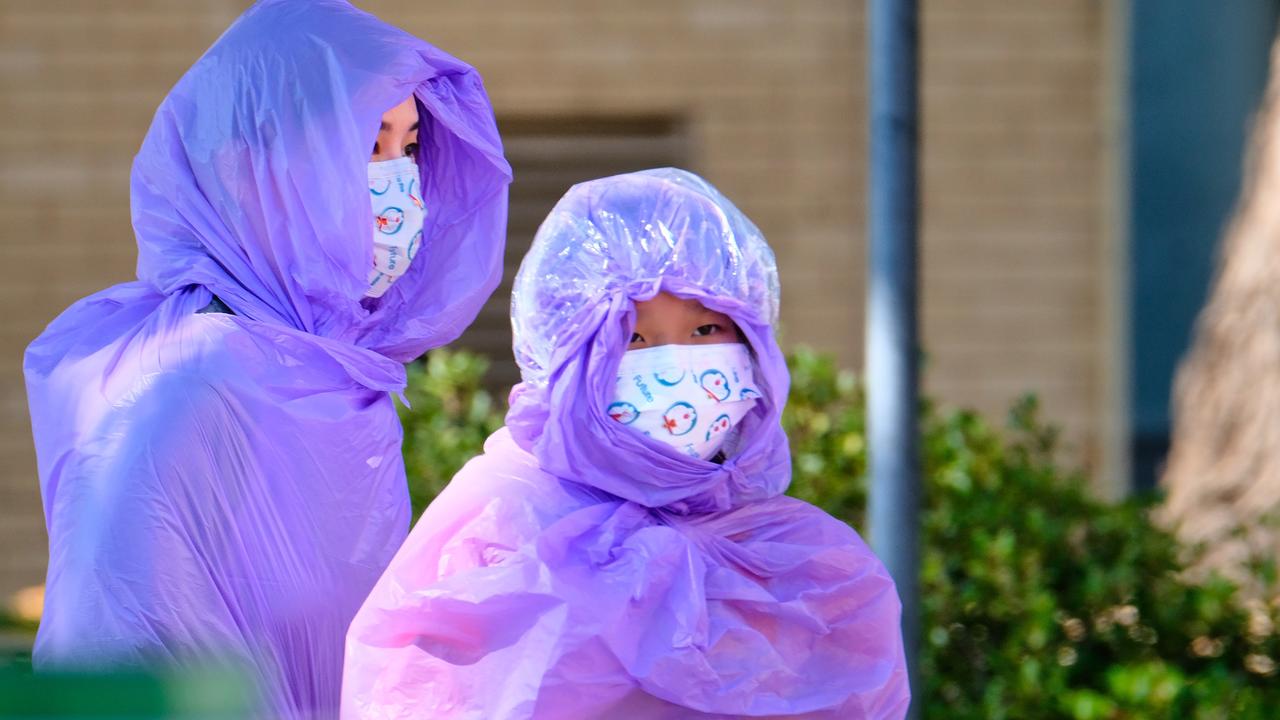 Quarantining hotel guests at the Holiday Inn near the Airport are moved to a new location in Melbourne. Picture: AAP Image/Luis Ascui