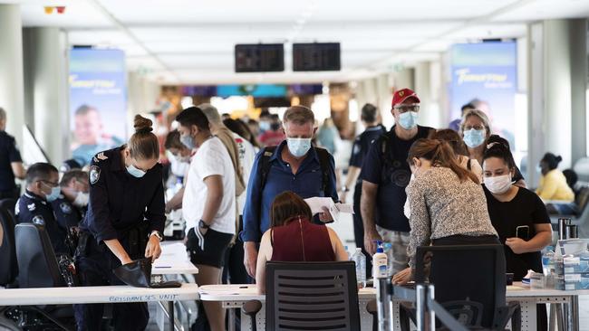 All people coming from Sydney being checked by Police upon arrival at Brisbane Domestic Airpor.