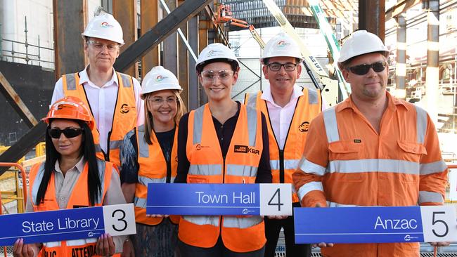 Jacinta Allen and Daniel Andrews with Metro tunnel Employees holding other new station names. Picture: AAP/James Ross