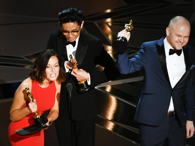 Makeup artists Lucy Sibbick, Kazuhiro Tsuji and David Malinowski accept Best Makeup and Hairstyling for Darkest Hour. Picture: Getty Images