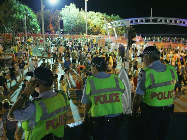 GOLD COAST, AUSTRALIA - NOVEMBER 23:  Police officers watch over the Schoolies week celebrations in Surfers Paradise on November 23, 2008 on the Gold Coast, Australia. Schoolies is the annual celebration by year 12 students following the culmination of their HSC exams. The celebrations happen in several official locations throughout Australia, but the Gold Coast kicks off the celebrations as the Queensland exams finish ahead of all other states.  (Photo by Sergio Dionisio/Getty Images)