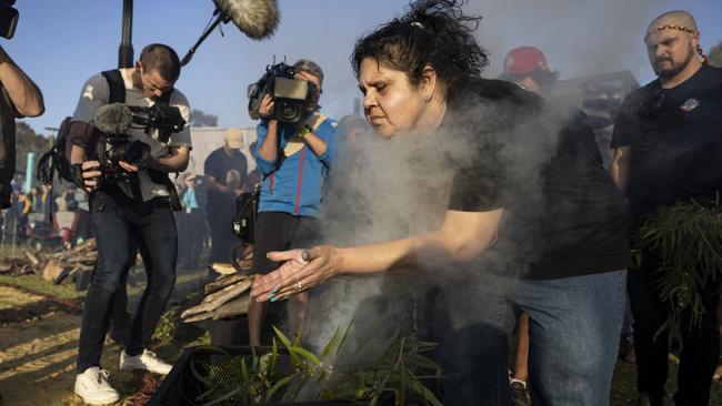 Mechelle Turvey takes part in the smoking ceremony at the vigil for Cassius on Monday. Picture: Getty Images