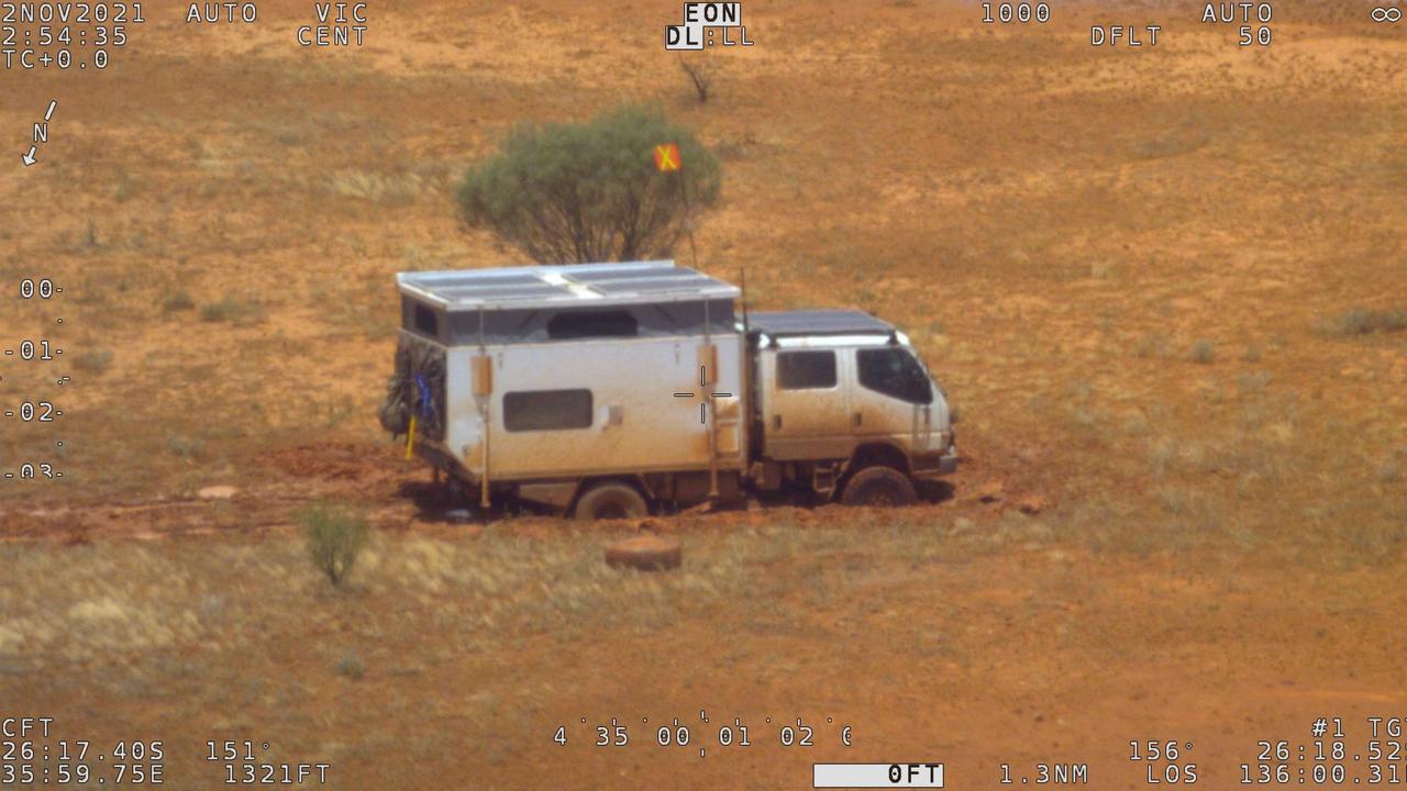 The stranded campervan following torrential rain in remote South Australia, about 150 kilometres northwest of Oodnadatta. Picture: Handout / Australian Maritime Safety Authority (AMSA) / AFP.
