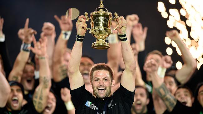 New Zealand gun Richie McCaw lifts the Webb Ellis Cup after winning 34-17 during the 2015 Rugby World Cup. Picture: AFP