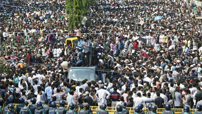 Bangladesh Nationalist Party activists face off with police in Dhaka on Saturday. Picture: Reuters